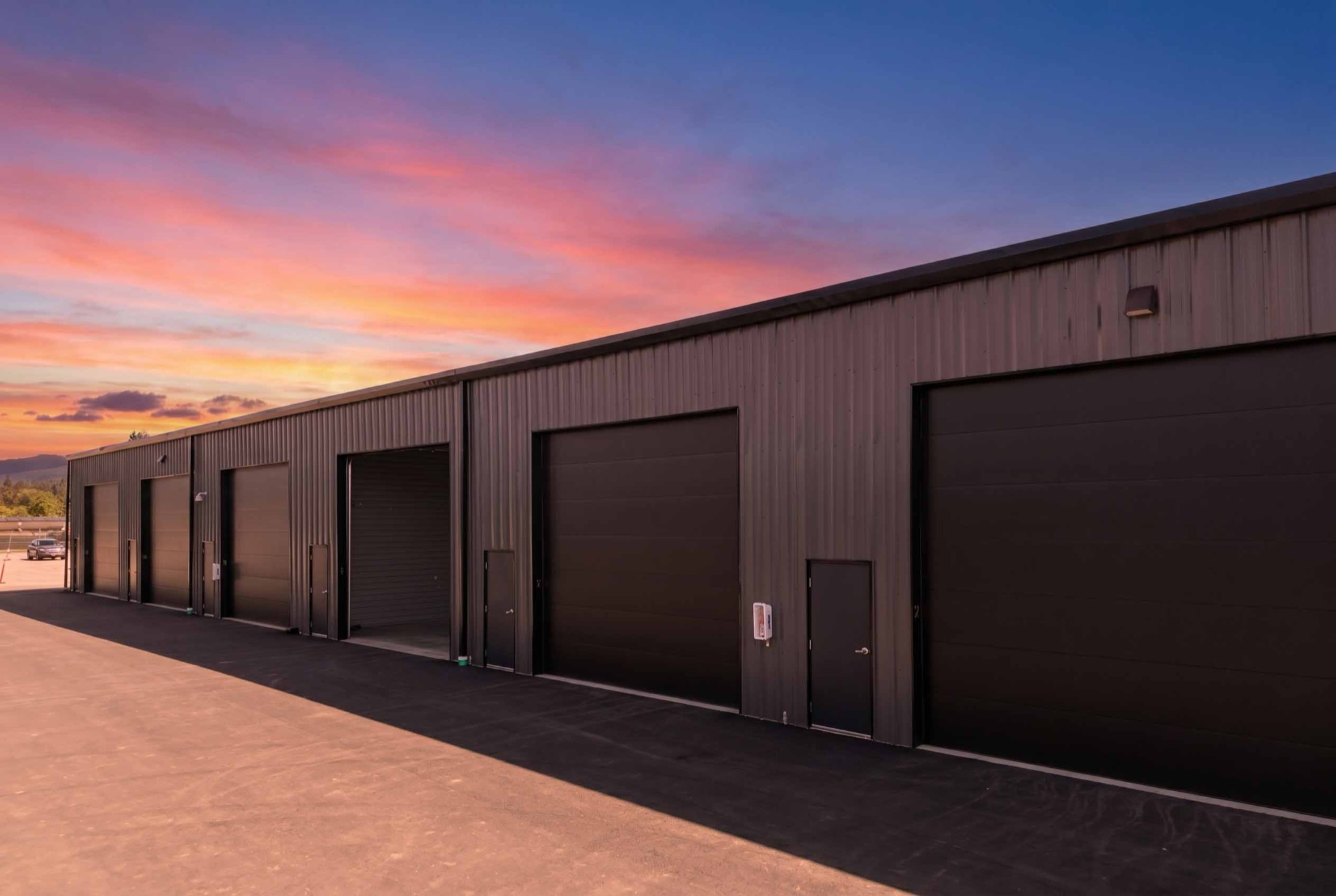 Locked & Loaded garage condo building at sunset