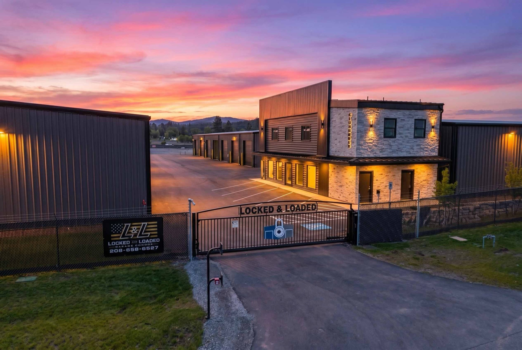 Gated entrance at Locked & Loaded Garage Condos at dusk